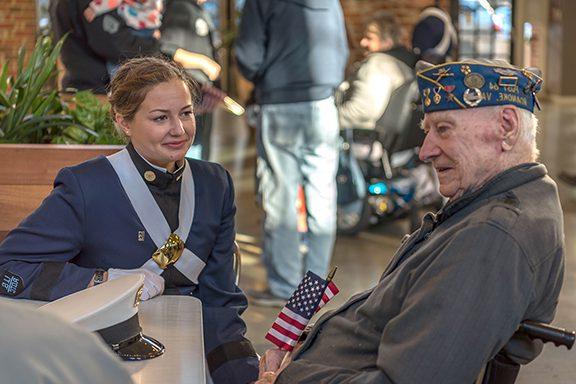 A veteran talks with a cadet.